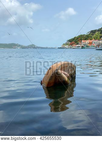 A Half Sunken Boat In The St Georges Bay In Grenada.