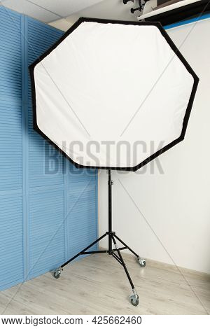 Studio Flash With Octabox Standing In The Corner Of The Studio. Front View.