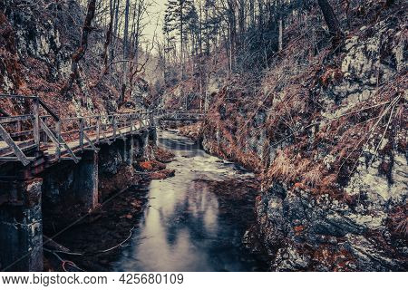 Landscape Of Old Wooden Bridge Over River In Mountains. Green Spring And Devil's Passage (zeleni Vir