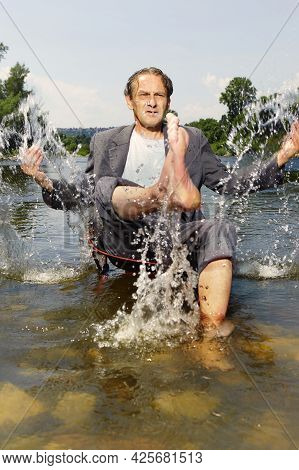 Manager In Grey Suit Became Crazy Of Hot Weather And Cooling In River