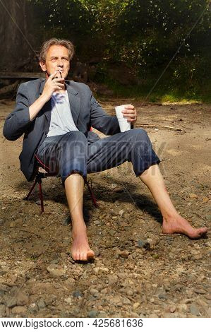 Manager In Grey Suit Became Crazy Of Hot Weather And Cooling On River Bank