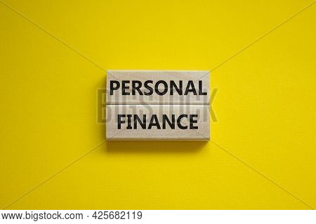 Personal Finance Symbol. Wooden Blocks With Words Personal Finance On Beautiful Yellow Background, C