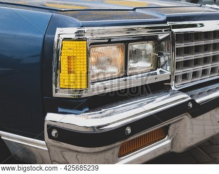 Self-made Car Headlamp. Vehicle Headlamp Made Of Yellow Toy Blocks. Funny Tuning Of Old Auto