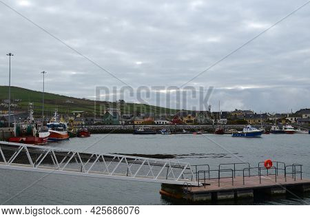 Picture Perfect Colored Homes In Dingle Harbor In Ireland.