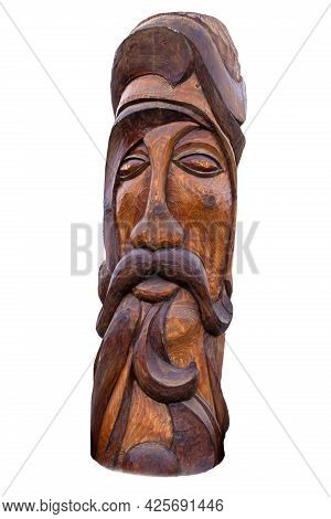 Wooden Idol Statue Of Koryak On A White Background. Selective Focus