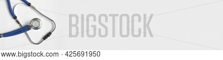 Sthethoscope On White Background With Copyspace. Medical Long Horizontal Banner With Hospital Tool.