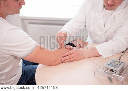 Patient Nerves Testing Using Electromyography At Medical Center
