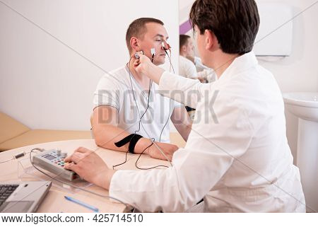 Patient Nerves Testing Using Electromyography At Medical Center