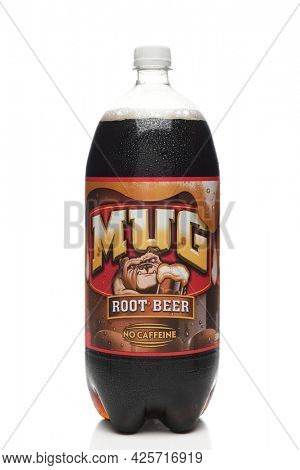 IRIVNE, CALIFORNIA - 3 JULY 2021: A 2 liter bottle of Mug Root Beer on white with reflection. 