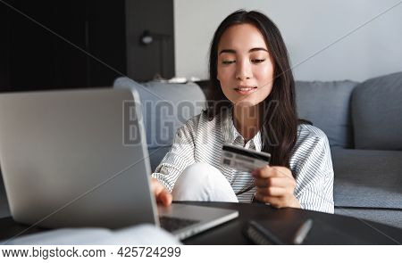 Image Of Young Asian Woman Order Online, Shopping From Home. Girl Enter Credit Card Info On Webside 