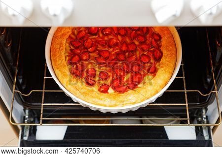 Closeup Homemade Gallet With Strawberries And Rhubarb  Baked In A Home Oven. Shallow Focus. High Ang