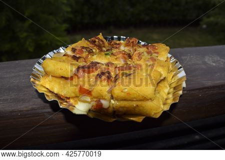Bread Cheese Pudla, Tasty Indian Snack Item Breakfast Or Tea Time. Indian Breakfast Served Outdoors.