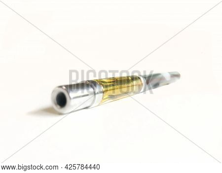 Vape Pen With Golden Marijuana Resin In The Vile.