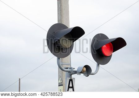 Square Grade Crossing Signal With Red Light Gate And Crossbuck At Railroad Crossing.