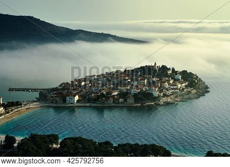 Primosten, seascape at sunset - Croatia, Adriatic sea, Dalmatia, Europe. Drone photo, clouds, mystical.