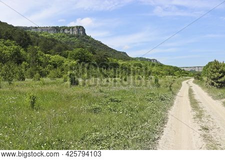 Road Through The High-mountain Plateau To The Karalez Valley, Crimea, Russia. Summer Mountain Landsc