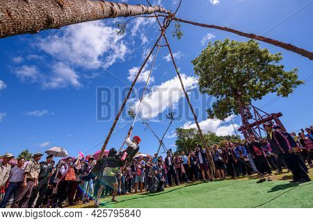 Akha Tribe Playing With The Wooden Swing On Akha Swing Festival At Doi Mae Salong. The Annual Akha S
