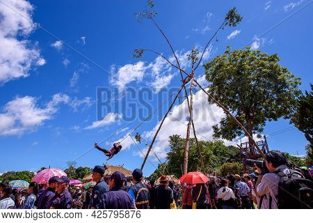 Akha Tribe Playing With The Wooden Swing On Akha Swing Festival At Doi Mae Salong. The Annual Akha S