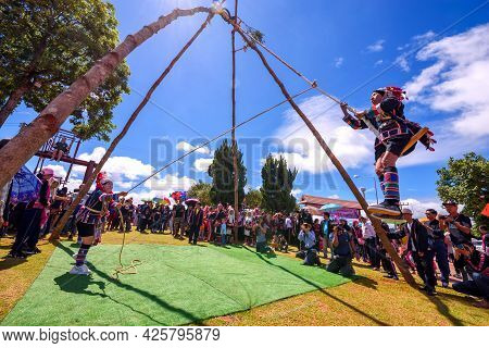 Akha Tribe Playing With The Wooden Swing On Akha Swing Festival At Doi Mae Salong. The Annual Akha S