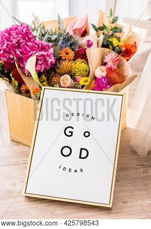 Flowers with a golden frame mockup
