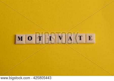 Square Letters With Text Motivate Isolated On Yellow Background