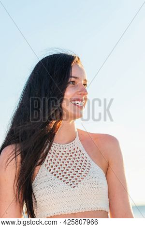Portrait Young Woman Walking On The Beachsunset Day.beach Woman In Fashion Beachwear Relaxing Walkin
