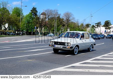 Bucharest, Romania, 24 April 2021 Old Retro White Romanian Dacia 1310 Classic Car In Traffic In A St