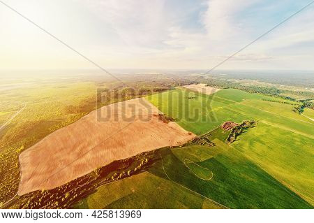 Aerial View Of Agricultural And Green Fields In Countruside. Nature Landscape In Summer Day