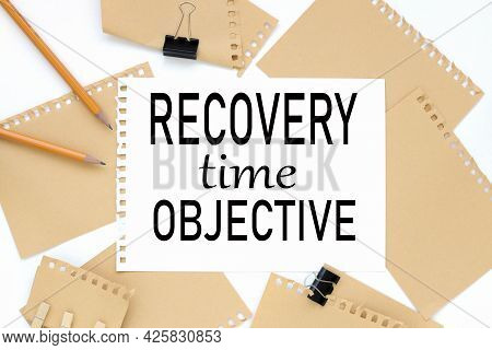 Rto Acronym - Recovery Time Objective. Text On White Notepad Paper. On A White Photo With Torn Paper