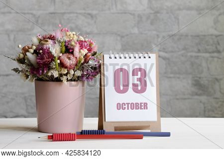 October 03. 03-th Day Of The Month, Calendar Date.a Delicate Bouquet Of Flowers In A Pink Vase, Two 