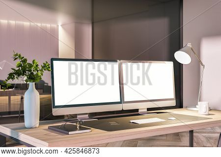 Modern Office Interior With Desk Top, Blank White Computer Monitors And Other Items. Mock Up, 3d Ren