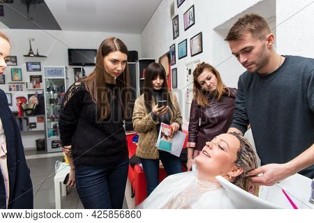 Keune Brand Technologist Artem Raychuk Dyes The Hair Of A Model On Advertising Workshop