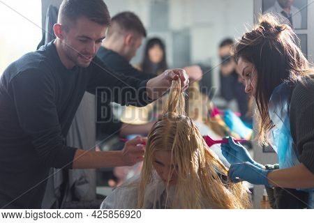 Keune Brand Technologist Artem Raychuk Dyes The Hair Of A Model On Advertising Workshop