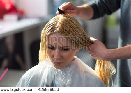 Keune Brand Technologist Artem Raychuk Dyes The Hair Of A Model On Advertising Workshop