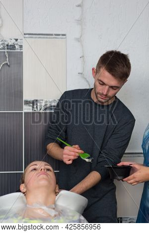 Keune Brand Technologist Artem Raychuk Dyes The Hair Of A Model On Advertising Workshop