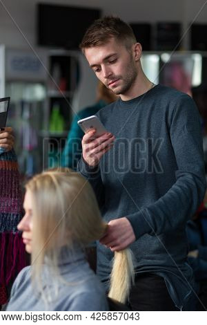 Keune Brand Technologist Artem Raychuk Dyes The Hair Of A Model On Advertising Workshop