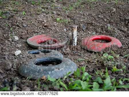 Some Quoits Resting In The Hole Around The Peg.