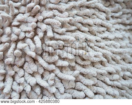 Close-up Of A Long Pile On The Carpet Of Beige Or Gray. A Non-slip Bath Mat Or Toilet. Long Carpet. 