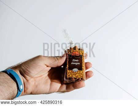 Paris, France - Jul 30, 2017: Pov Male Hand Holding Package With Ostmann Cinnamon Sticks Zimt-stange