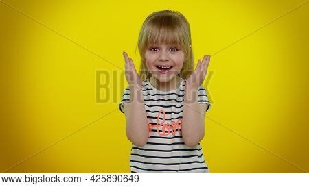 Oh My God, Wow. Excited Amazed Blonde Child Girl 5-6 Years Old Raising Hands In Surprise Looking At 
