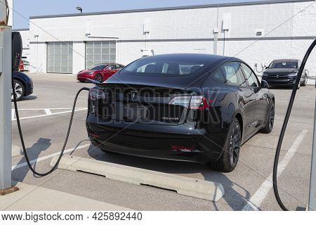 Indianapolis - Circa July 2021: Tesla Electric Vehicles Awaiting Preparation For Sale. Tesla Product