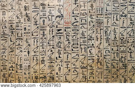 Ancient Egyptian Hieroglyphs And Images Of People On The Papyrus. The Writing Of The Ancient Egyptia