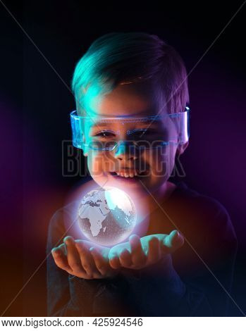 Cute little boy using digital glasses. sci-fi, earth awareness, future mind controlling concept