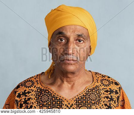 Mixed senior Indian man wearing a yellow turban mockup