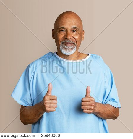 Patient doing a thumbs up hand gesture