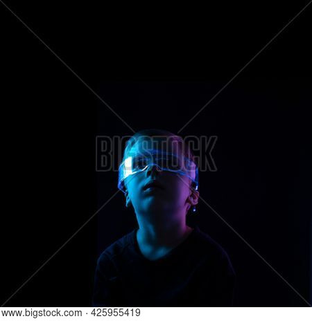 Cute little boy using digital glasses. sci-fi, earth awareness, future mind controlling concept