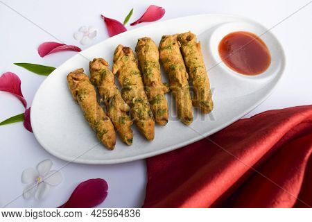 Delicious Babycorn Fritters, Indian Tea Time Snacks With Tomato Ketchup. Female Holding Serving Baby