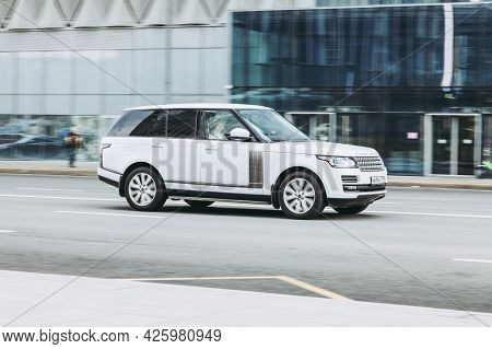 Moscow, Russia - April 2021: Brand New Range Rover L405 Side View. Sport Suv White Color Driving Aga