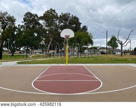 Recreational Facilities With Basketball Court In Residential Community Park In Placentia, California