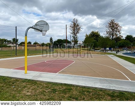 Recreational Facilities With Basketball Court In Residential Community Park In Placentia, California